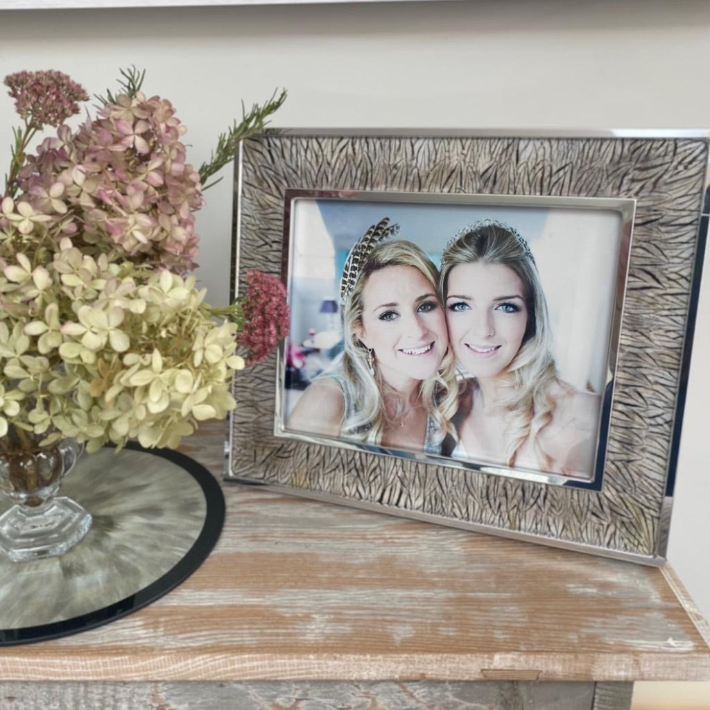 Silver Pheasant Feather Photo Frame on a console table