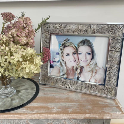 Silver Pheasant Feather Photo Frame on a console table
